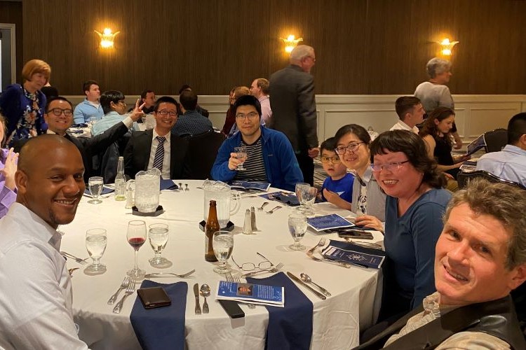 Faculty seated at a table at Spring Department Banquet