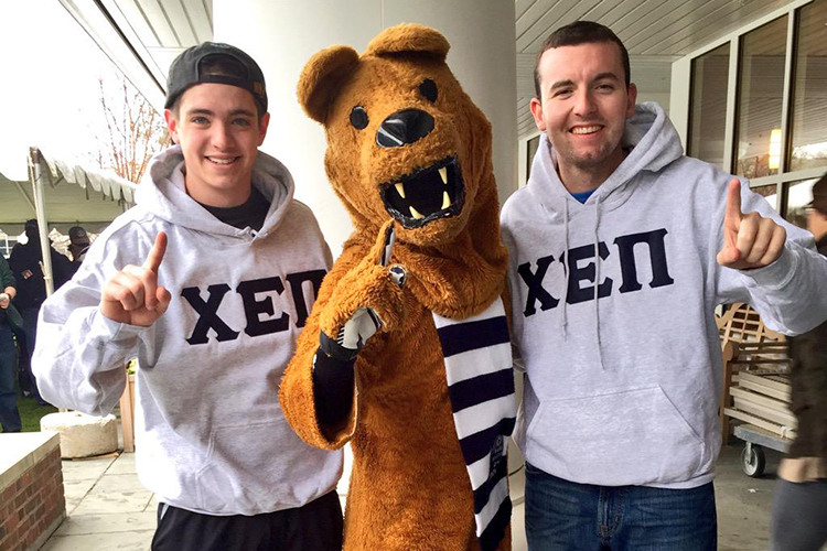 Students wearing Chi Epsilon Pi sweatshirts with the Nittany Lion