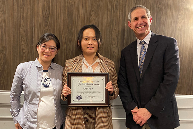 Laifang Li, Yifei Fan, and Jon Nese at the spring 2023 department banquet