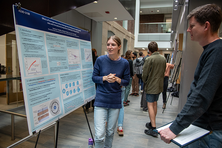 Graduate student Gwenore Pokrifka describing her poster at an EMS Research Showcase