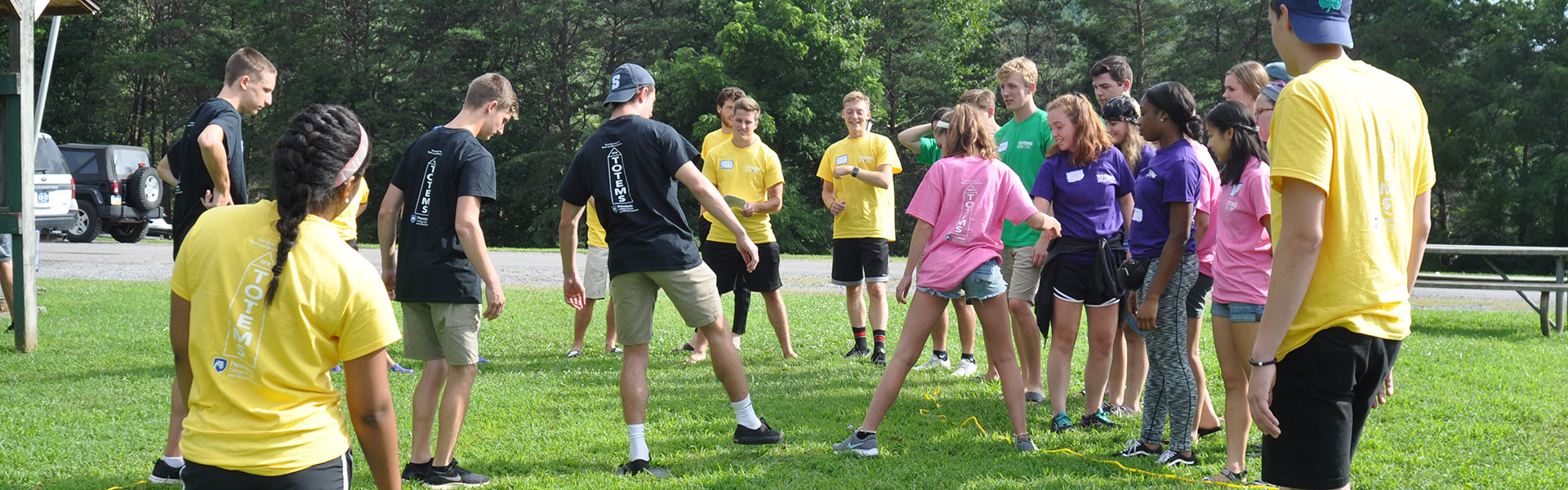 TEEMS participants in a field playing hackey sack