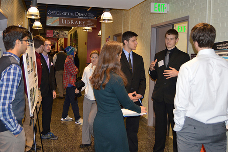 Undergraduate students at a poster session